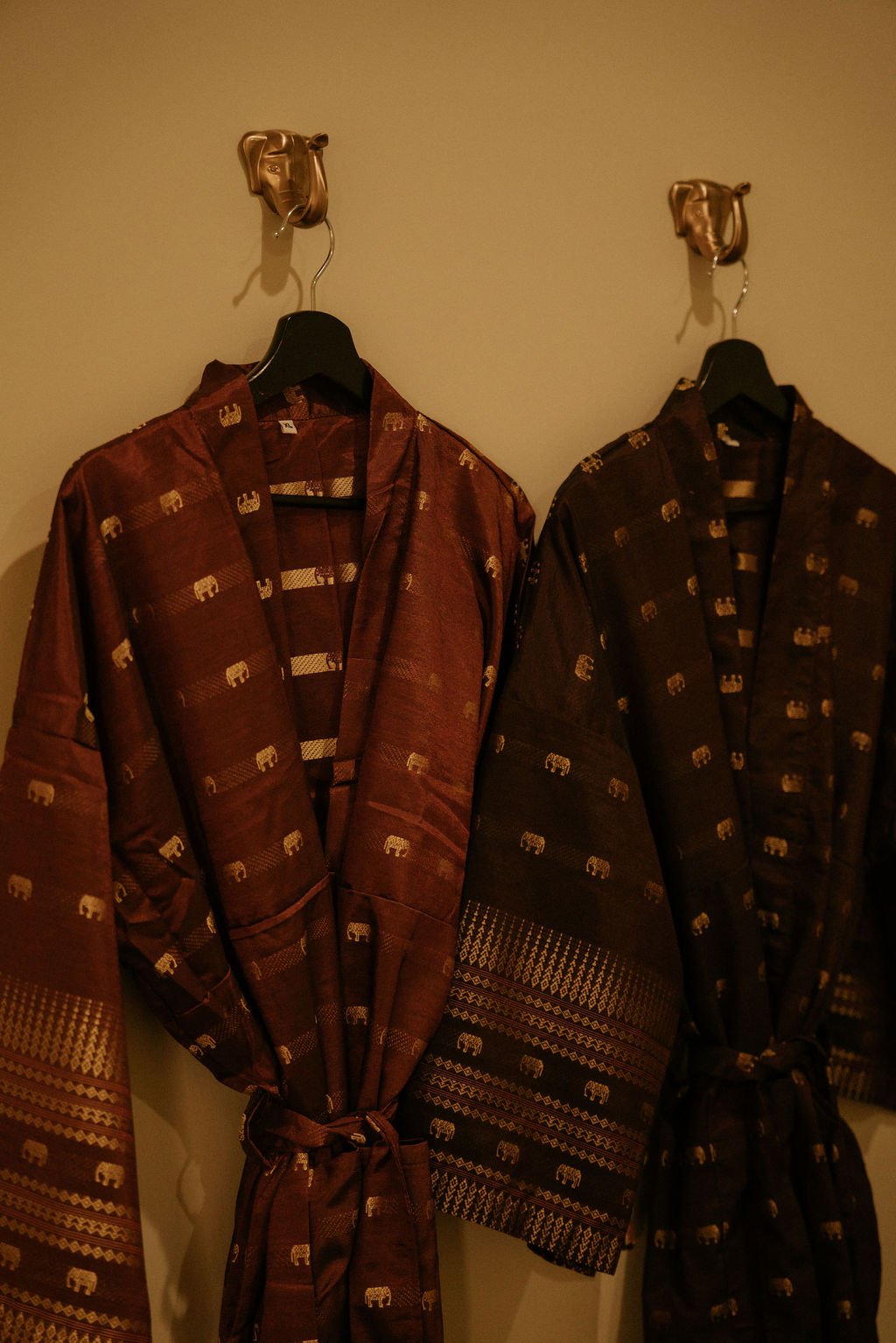 Matching Thai silk robes hanging at Siam Ivory Spa San Antonio